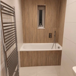 white bathroom with wood panelling